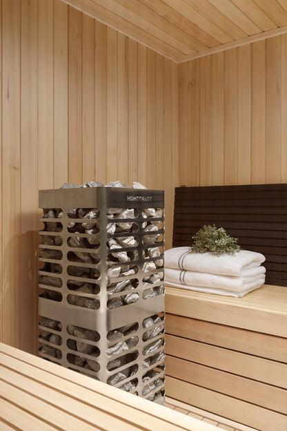 Homecraft Revive sauna heater in a cedar corner beside folded towels