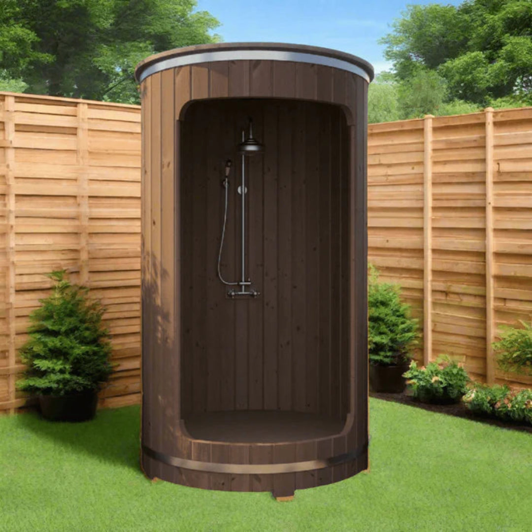 SaunaLife R3 barrel shower in Thermo-Spruce beside a cedar fence