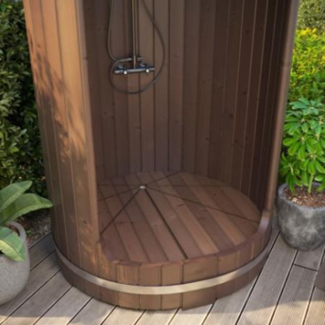 Inside the R3 barrel shower with the wood floor mat