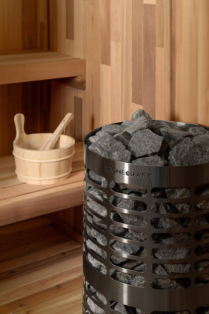 Homecraft Apex sauna heater in a cedar sauna with a wooden bucket and ladle